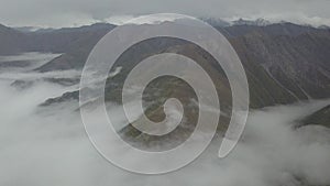 View from the drone and the height of the bird's flight on the mountains above the clouds