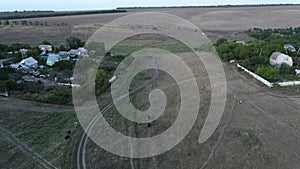 View from drone to the village, dirt roads and cows herd