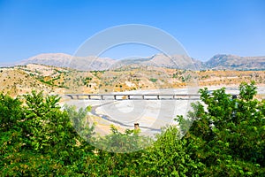 View of dry mountains with highway bridge in semi-arid climate photo