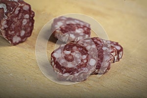 view of dry sausage on cutting board