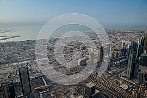 View of Dubai from above from the observation deck of the Burj Khalifa skyscraper on Sheikh Zayed Highway, Persian Gulf in the