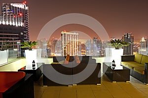 The view on Dubai city from skyscraper in night illumination