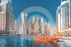 View of dubai marina port and tall skyscrapers. Tourist destinations and real estate concept