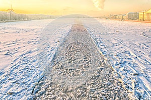 A view from Dvortsovy bridge towards to the Blagoveschensky one with the icebreaker trace.