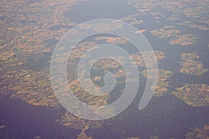 View of the earth landmass seen from an airplane window from Venice to Schiphol