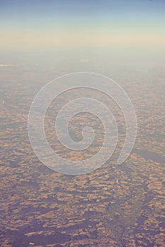 View of the earth landmass seen from an airplane window from Venice to Schiphol