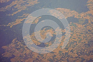 View of the earth landmass seen from an airplane window from Venice to Schiphol