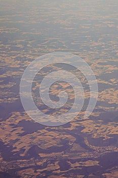 View of the earth landmass seen from an airplane window from Venice to Schiphol