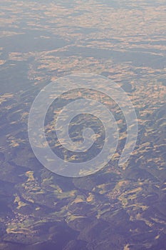 View of the earth landmass seen from an airplane window from Venice to Schiphol