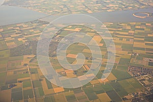 View of the earth landmass seen from an airplane window from Venice to Schiphol