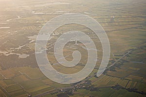 View of the earth landmass seen from an airplane window from Venice to Schiphol