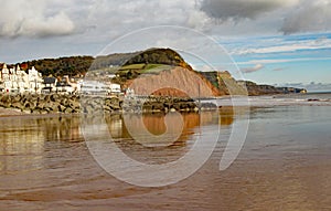 View of the easten end of Sidmouth Esplanade and sandstone cliff. This cliff has regular rockfalls which reduce the lengths of the