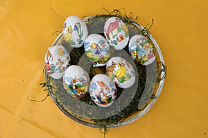 View on easter eggs on a yellow tablecloth