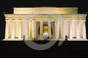 View of the eastern facade of the Lincoln Memorial illuminated at night-time