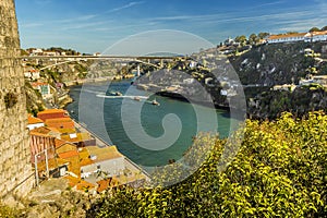 A view eastward along the Douro river in Porto, Portugal on a sunny afternoon