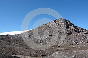 View from the edge of a crater to the top 1829 m of Gorely volcano photo