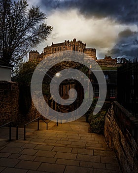 View of Edinburgh Castle with dark cloudscape above it. Scotland.