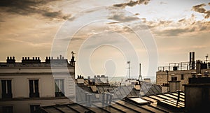 View of the Eiffel Tower above the rooftops of Paris