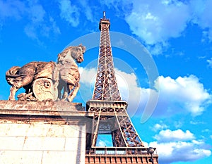 View of the Eiffel tower on a bright sunny day. Famous tourist place. Paris, France