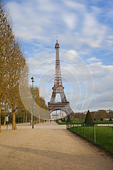 View of the Eiffel tower from Champ de Mars after sunrise