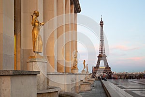 View of the Eiffel Tower with sculptures on Trocadero in Paris photo