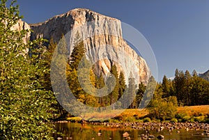 View of El Capitan from Merced River with autumn colors