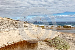 View of El Medano, Tenerife, Spain from behind a sandy cliff