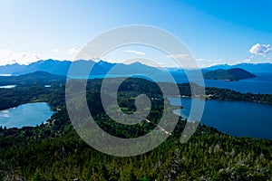 View of El Trebol Lagoon, Nahuel Huapi Lake and the mountains taken from Mount Campanario viewpoint