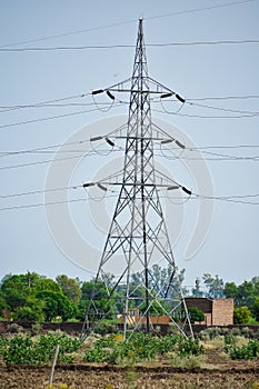 A view of a electric tower in an Indian village