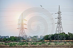 A view of a electric tower in an Indian village