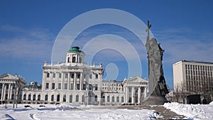 View of elegant neoclassical building of Pashkov House on Vagankovsky Hill in Moscow with monument to Vladimir Great in