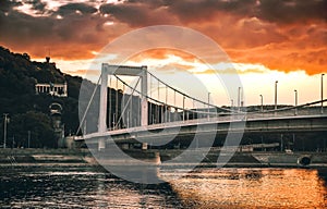 View of the Elisabeth bridge over the Danube captured from Pest side with the Gellert Hill in the background at sunset