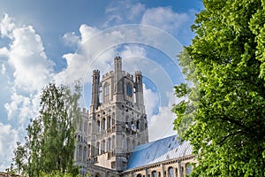 View of the Ely Cathedral against a blue sky with partial clouds, Cambridgeshire, Norfolk