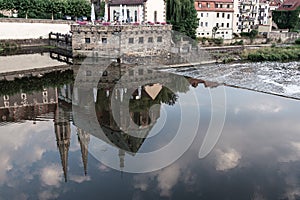 View of the embankment of the river, which reflects the Catholic Church. Landscape, architecture concept