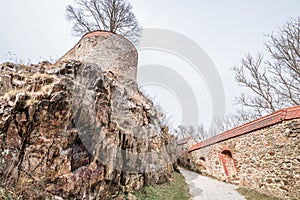 View through an embrasure in the castle wall of the fortress Feste Oberhaus near the three rivers city Passau with view on the cit