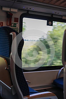 View of empty comfortable and clean blue seat inside German train