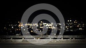 View from empty concrete bridge above the town at night