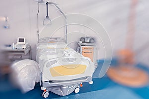 View of an empty hospital bed in the maternity ward at a hospital