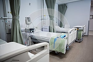 View of empty hospital beds in ward