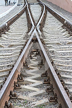 View of the empty railway fork, connection. Rails close-up with selective focus