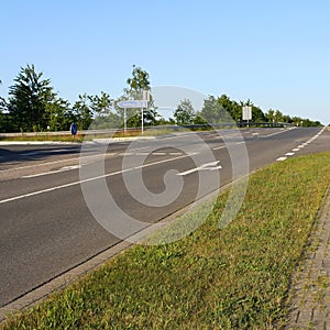 View of empty road in Itzehoe, Germany with traffic direction sign