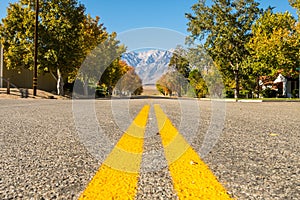View of an empty street with Black Mountain in the background in Independence, California, USA