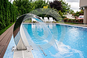 View of a empty swimming pool with blue wa