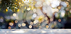 View of an empty wooden table top in a garden. Image with a gentle blurred soft light background of garden foilage. Bokeh effect photo