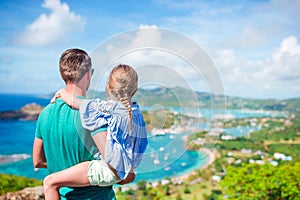 Family of dad and little kid enjoying the view of picturesque English Harbour at Antigua in caribbean sea