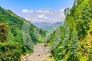 View enroute to Prashar Lake trekk trail through river bed. It is located at a height of 2730 m above sea level surrounded by