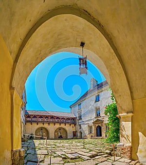 The view through the entrance arch on the courtyard of Olesko Castle, Ukraine