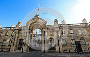 View of entrance gate of the Elysee Palace from the Rue du Faubourg Saint-Honore . Elysee Palace - official residence of