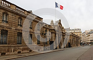 View of entrance gate of the Elysee Palace from the Rue du Faubourg Saint-Honore . Elysee Palace - official residence of