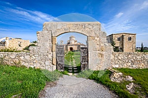 A view through the entrance gate of Panagia Kanakaria Church and Monastery in the turkish occupied side of Cyprus 2